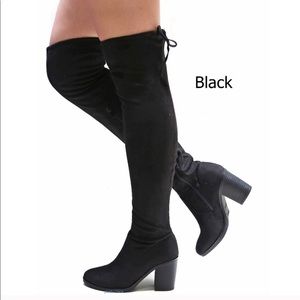 Knee high black boots with 3” heel